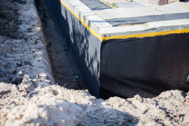 Professional Basement Waterproofing technician working in Wilson, PA